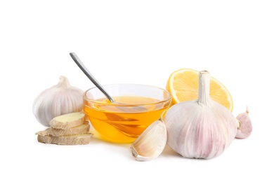 Photo of Composition with garlic and other cold remedies on white background