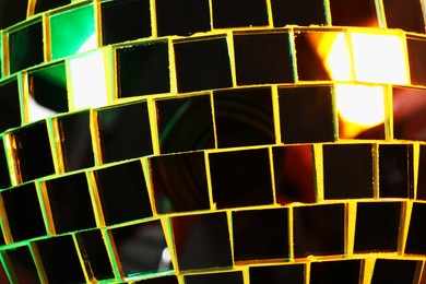 Shiny disco ball as background, closeup view