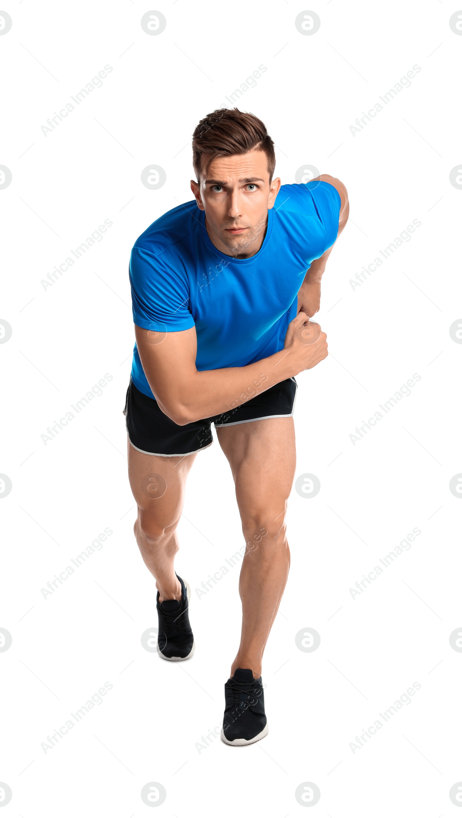 Photo of Sporty young man running on white background