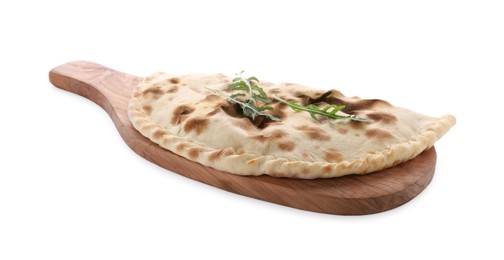 Wooden board with delicious calzone on white background