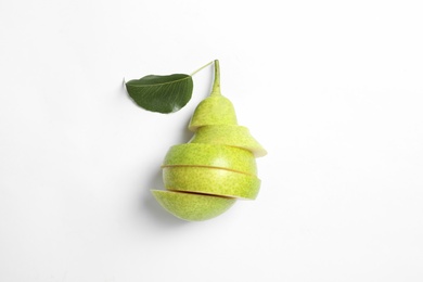 Cut pear on white background, top view