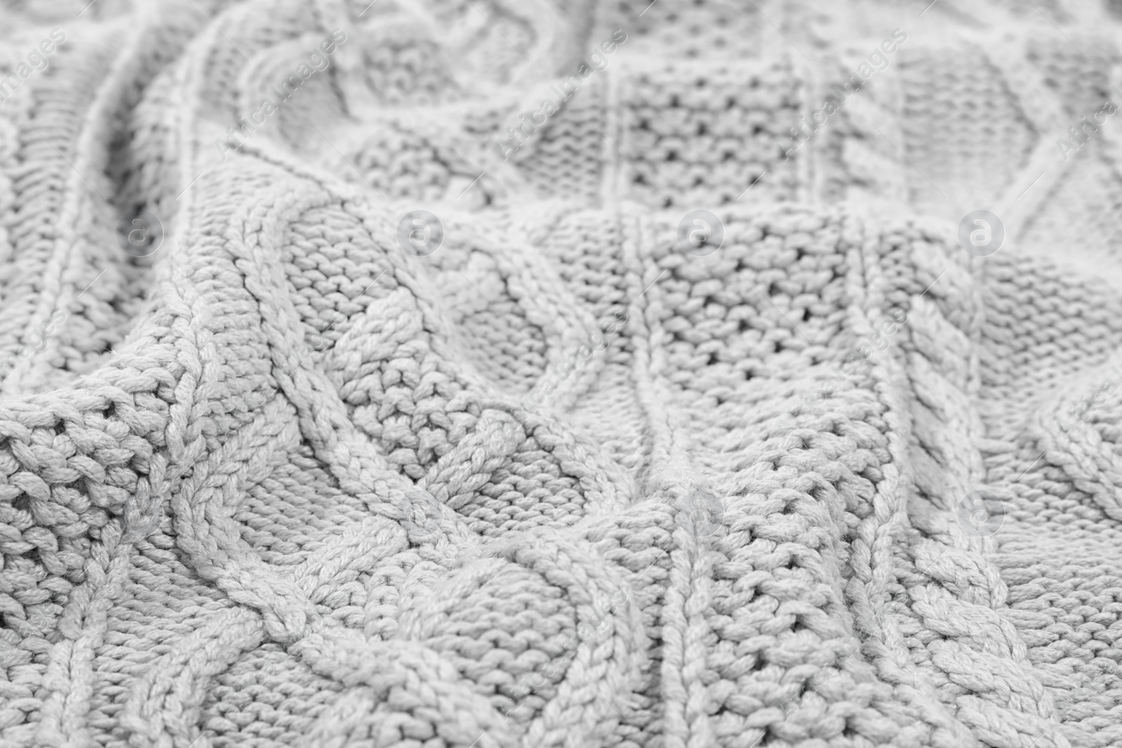 Photo of Texture of cozy warm sweater as background, closeup