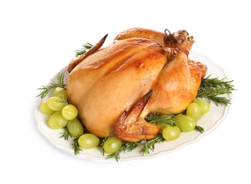 Photo of Platter of cooked turkey with garnish on white background