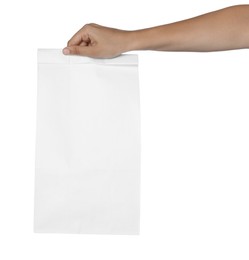 Woman holding paper bag on white background, closeup