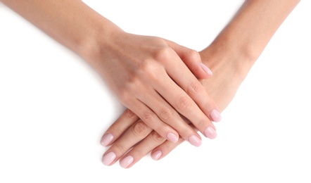 Photo of Woman with beautiful hands on white background, closeup. Spa treatment