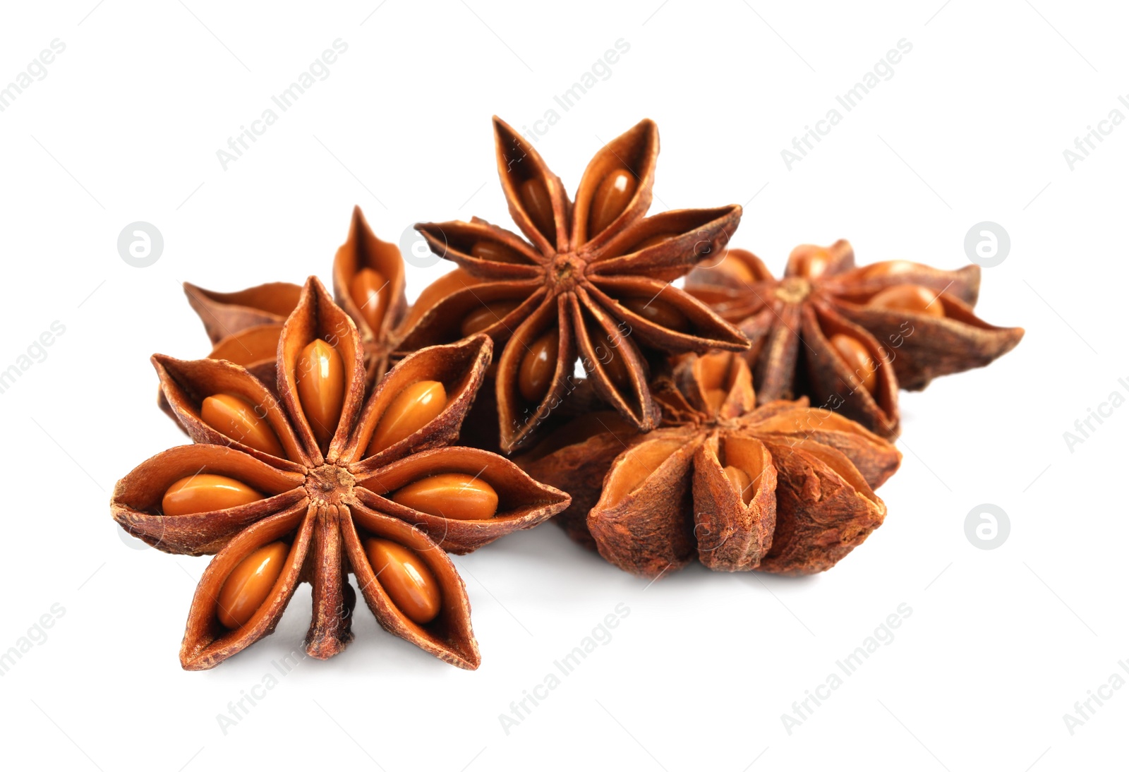 Photo of Dry anise stars with seeds on white background