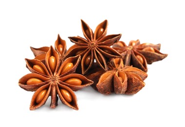 Dry anise stars with seeds on white background