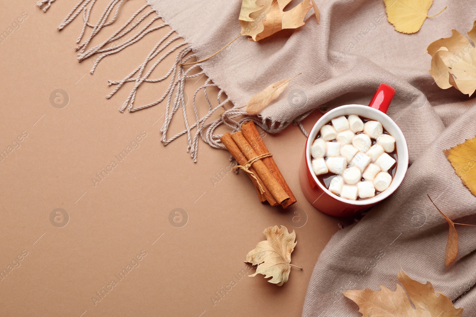 Photo of Flat lay composition with hot drink on beige background, space for text. Cozy autumn