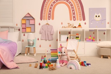 Many different toys on floor in child's room