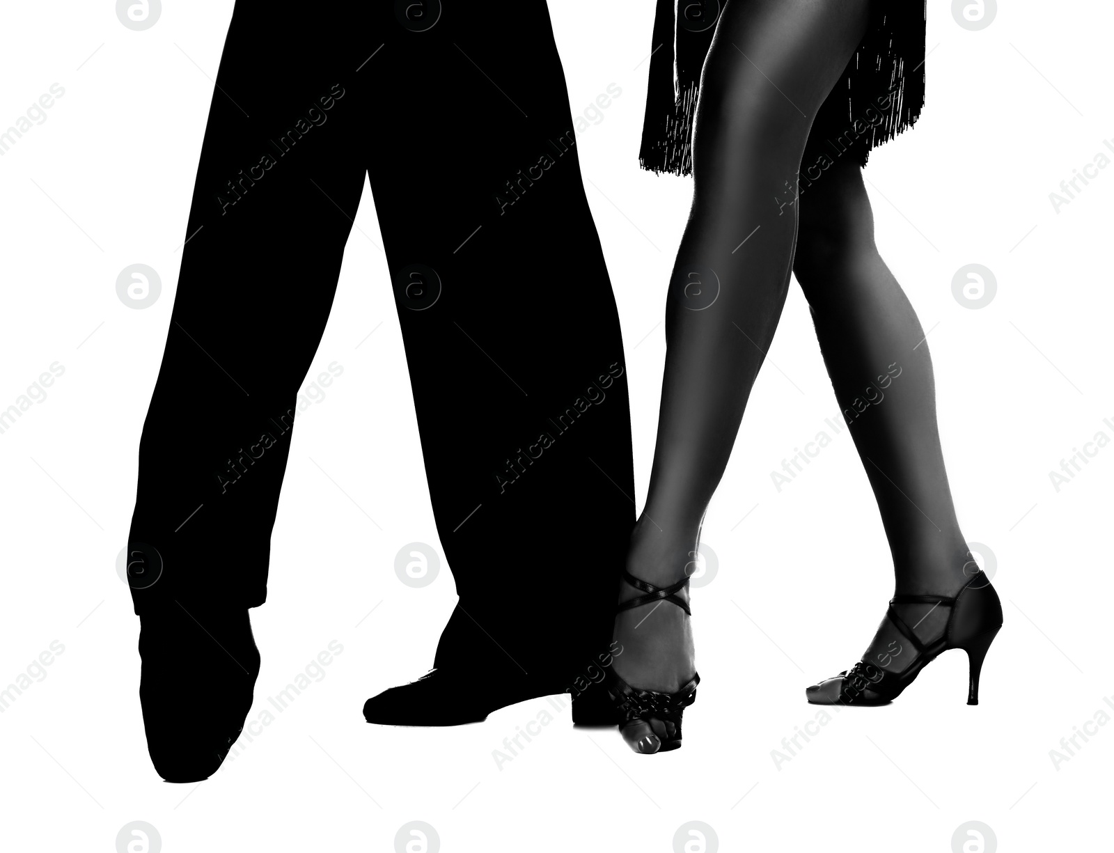 Image of Young couple dancing on white background, closeup of legs