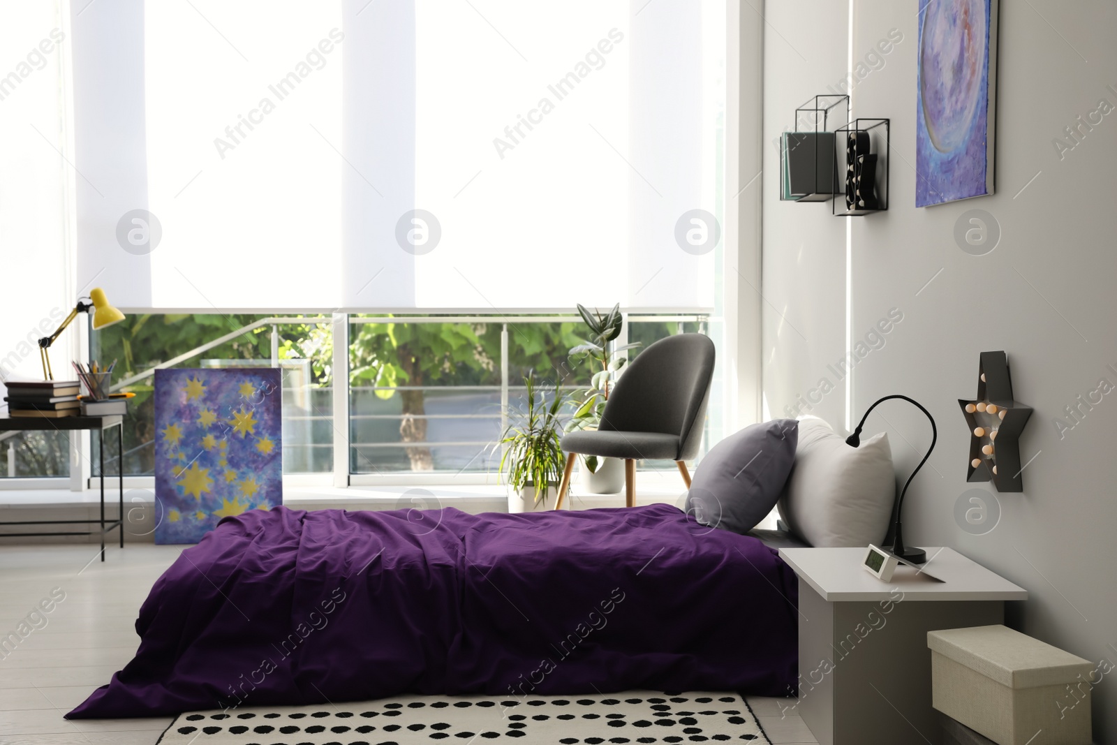 Photo of Modern teenager's room interior with comfortable bed and stylish design elements