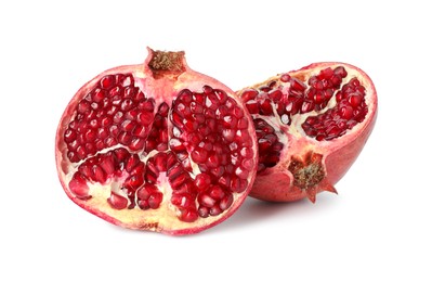 Photo of Halves of fresh pomegranate isolated on white