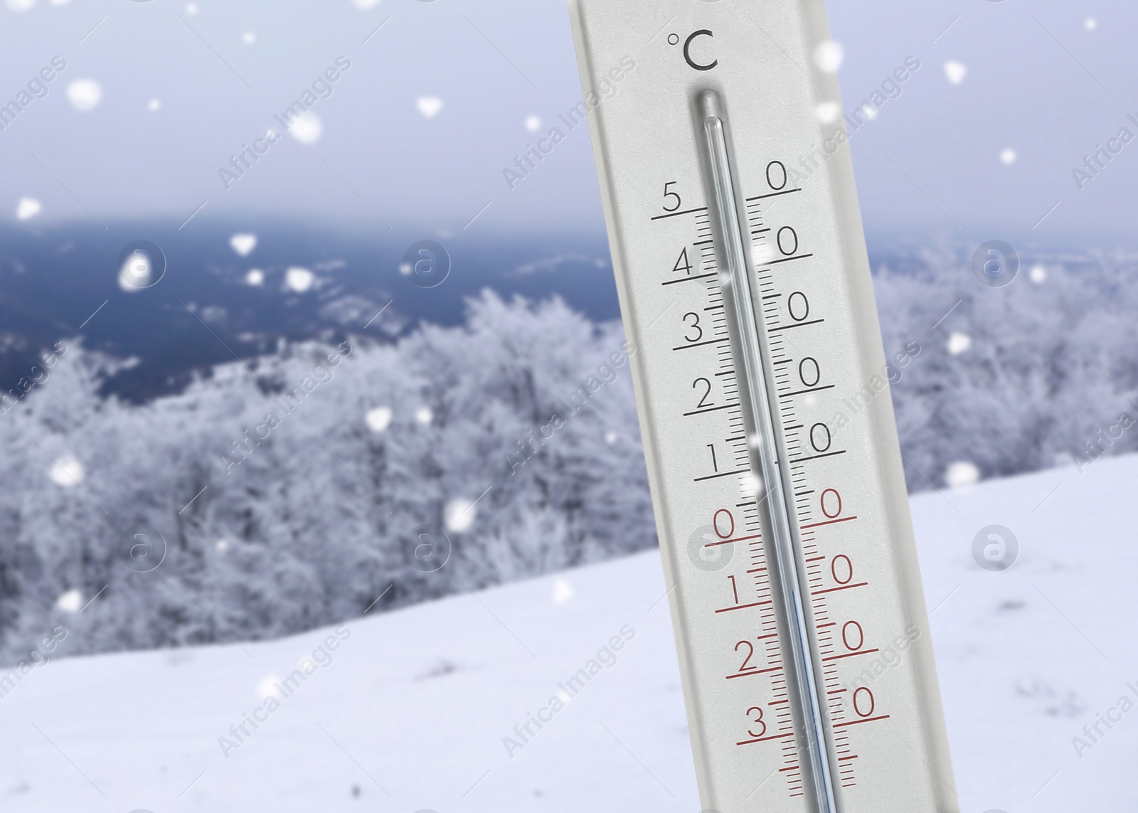 Image of Thermometer showing temperature below zero outdoors on winter day