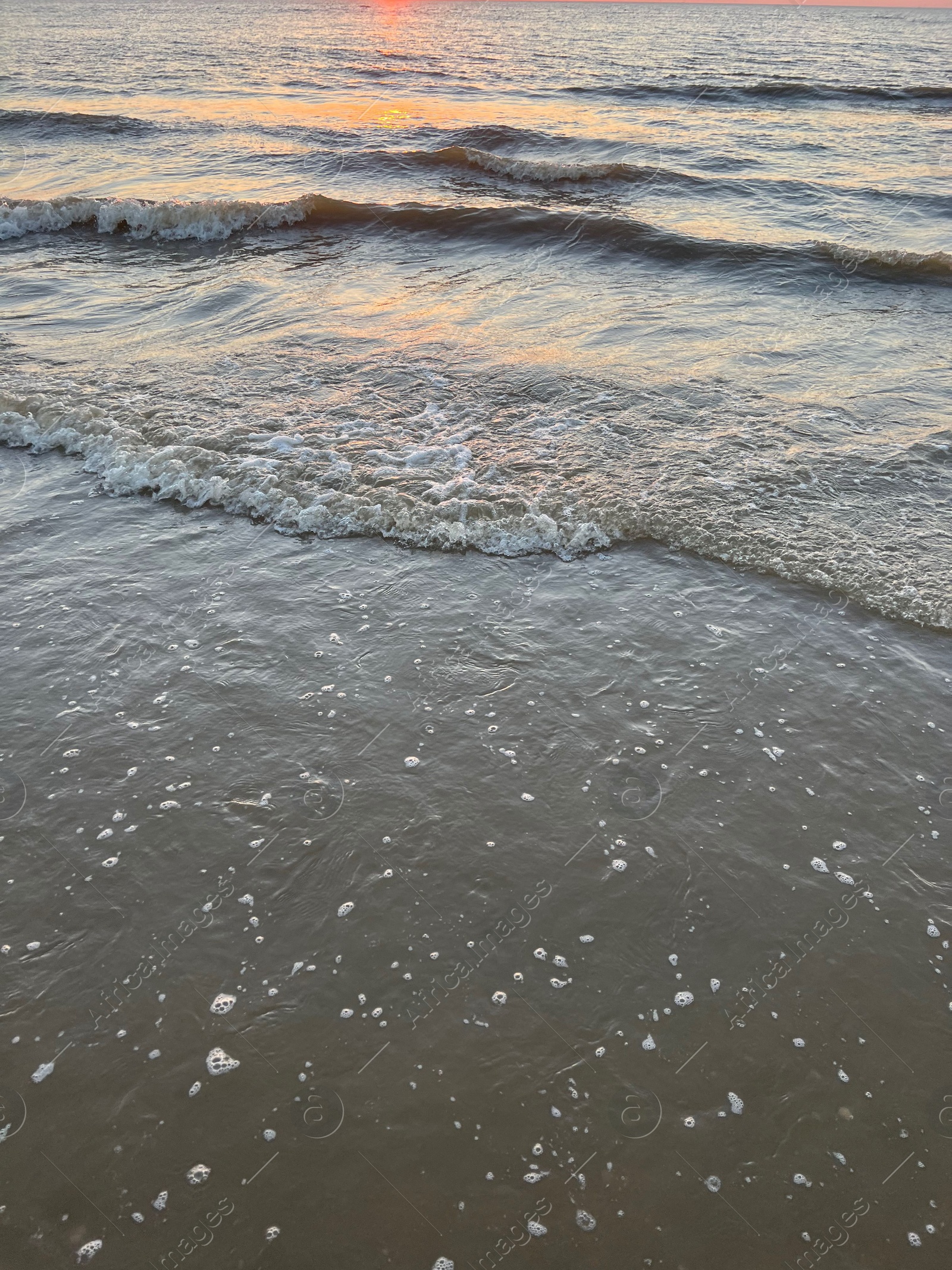 Photo of Beautiful view of sea waves at sunset