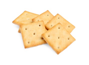 Photo of Tasty crispy square crackers isolated on white