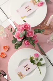 Photo of Romantic table setting with flowers and candles, flat lay