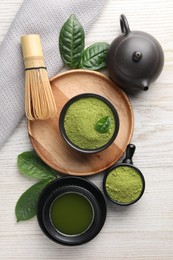 Photo of Flat lay composition with green matcha powder on white wooden table