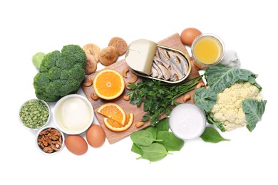 Photo of Set of natural food high in calcium on white background, top view