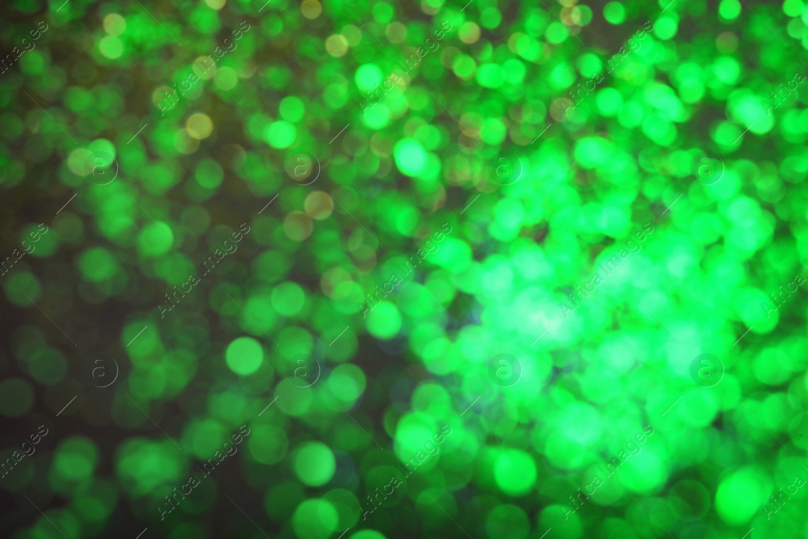 Image of St. Patrick day. Green background with blurred lights, bokeh effect