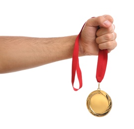 Man holding golden medal on white background, closeup. Space for design