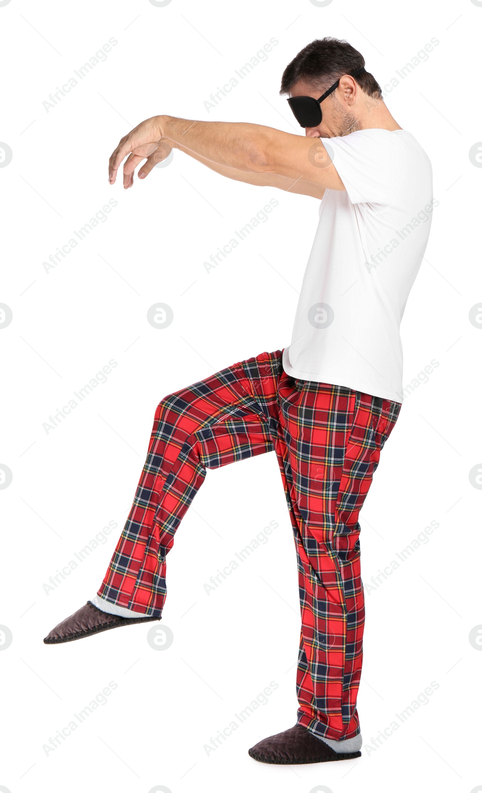 Photo of Man with eye mask in sleepwalking state on white background