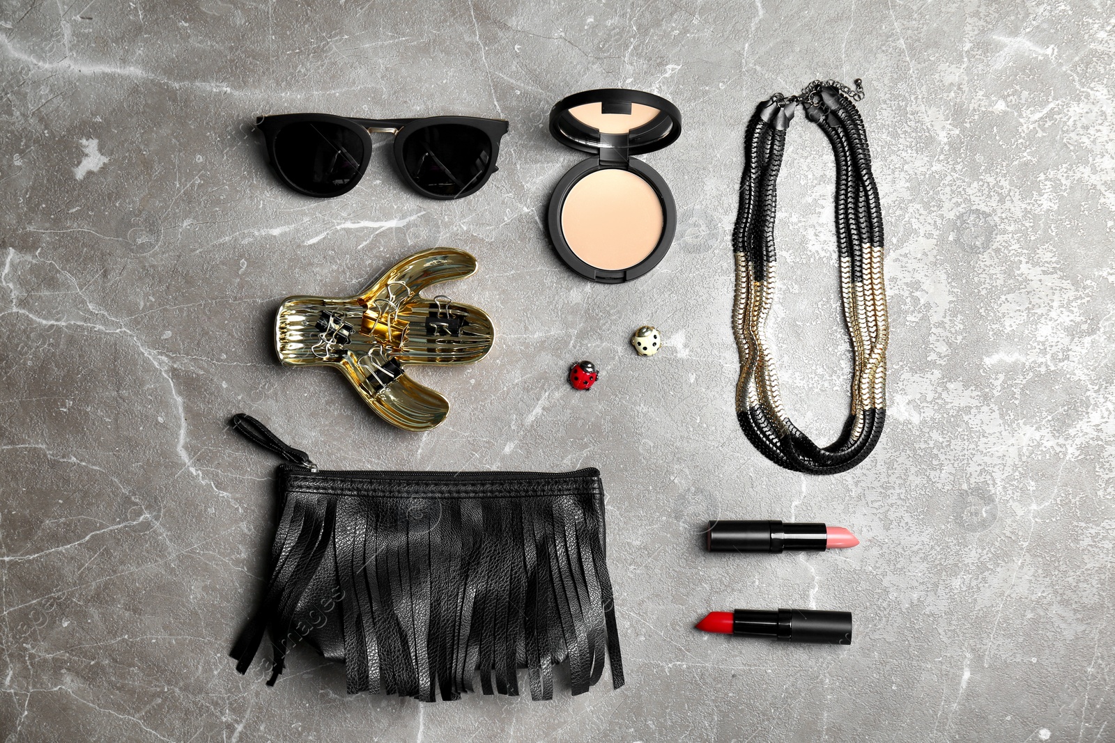 Photo of Flat lay composition with cosmetics and stylish accessories on grey background