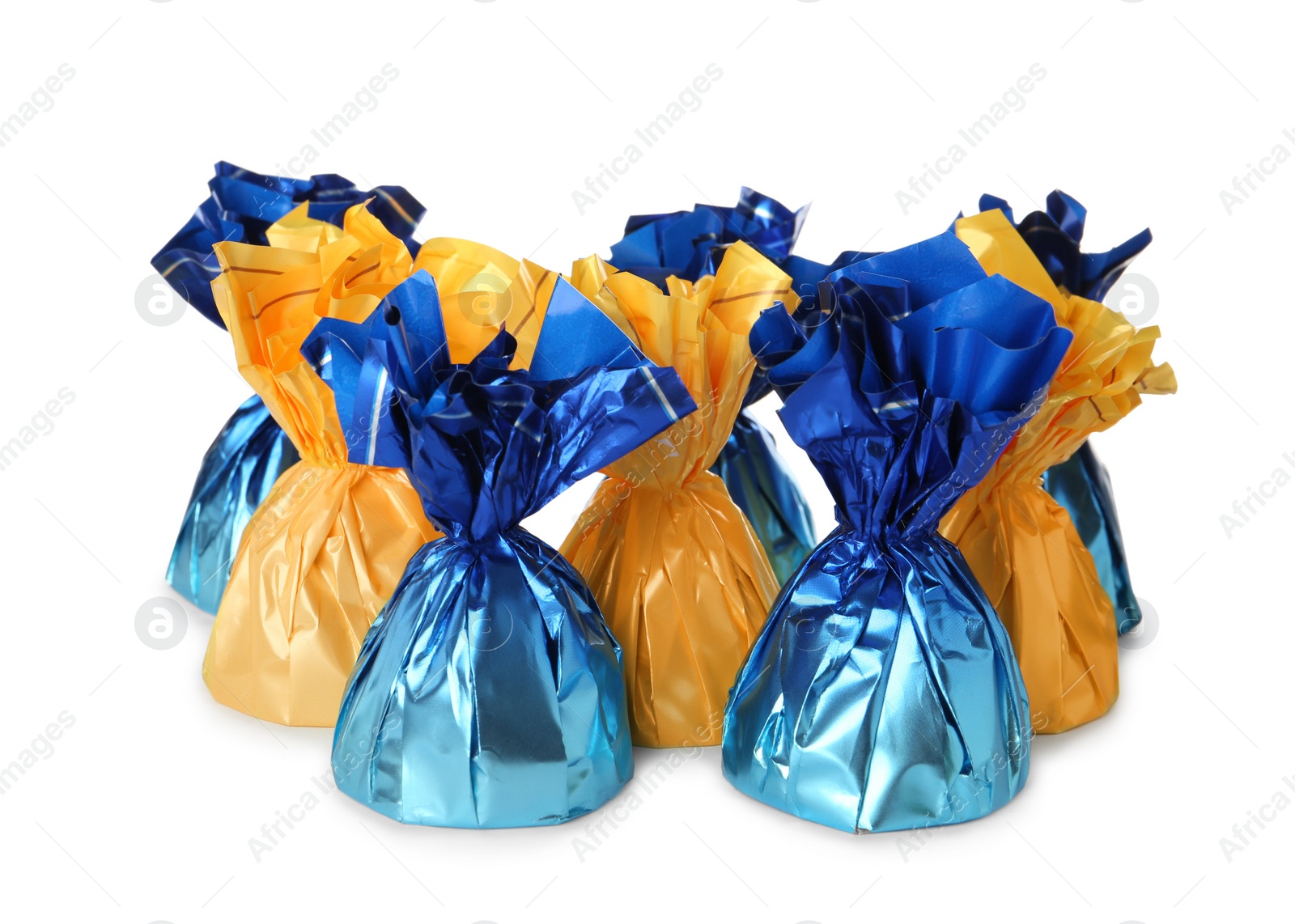 Photo of Delicious candies in colorful wrappers on white background