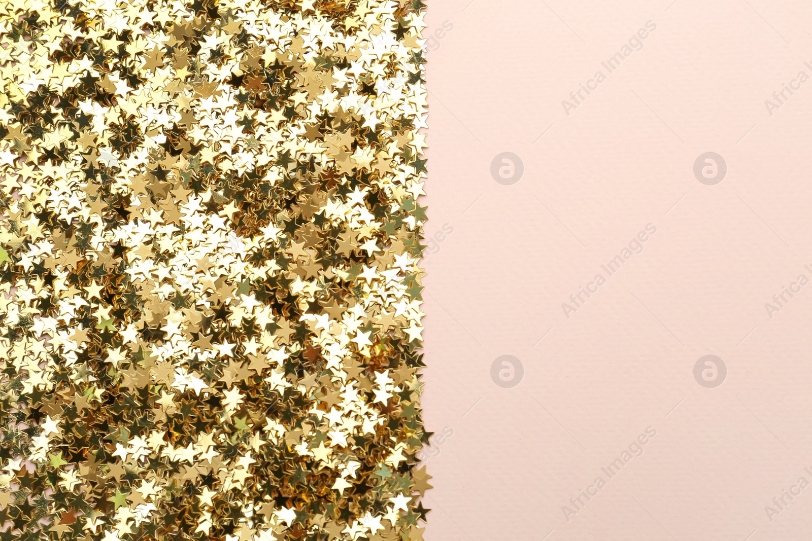 Photo of Confetti stars on pink background, flat lay with space for text. Christmas celebration