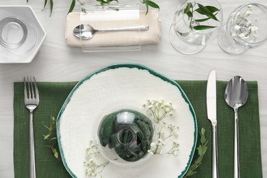 Photo of Elegant festive setting on white wooden table, flat lay