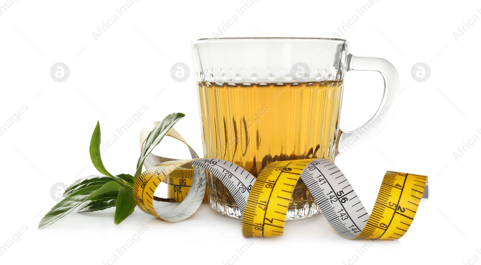 Photo of Diet herbal tea, green leaves and measuring tape on white background