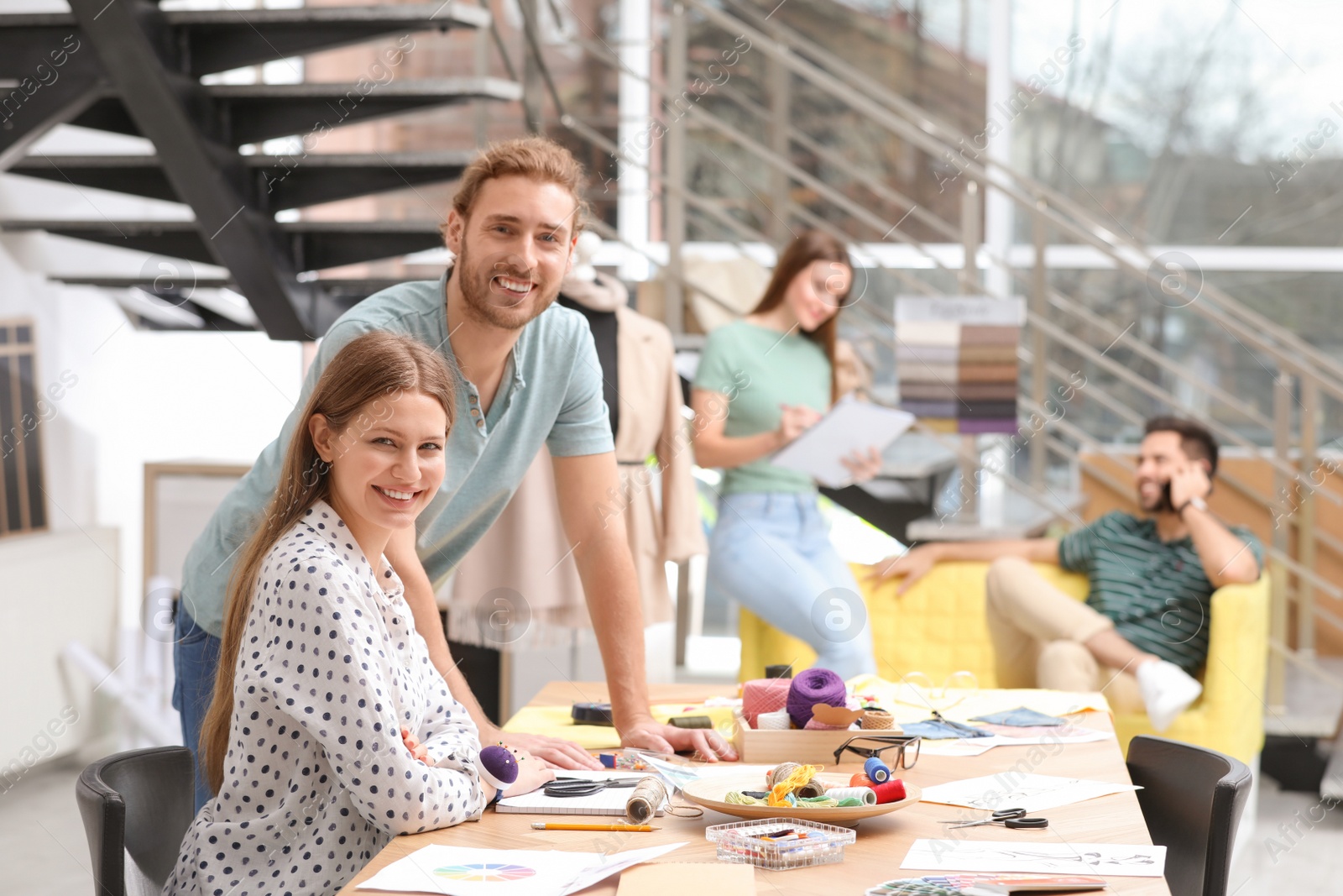 Photo of Fashion designers creating new clothes in studio