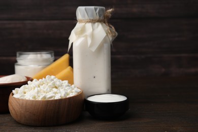 Photo of Different fresh dairy products on wooden table