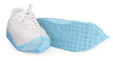 Sneakers in shoe covers isolated on white