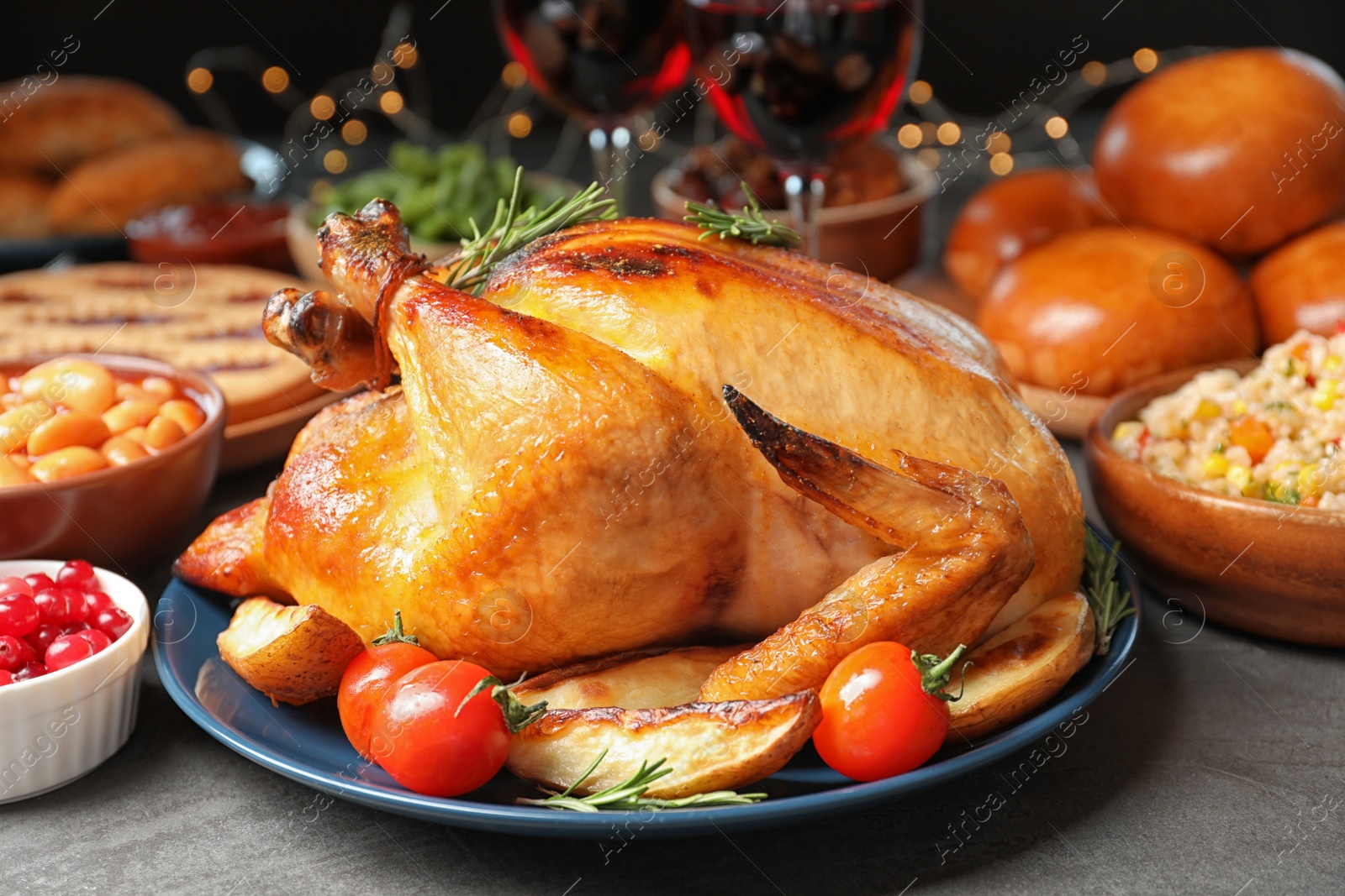 Photo of Traditional festive dinner with delicious roasted turkey served on table