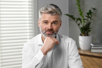 Man having video call at home, view from web camera