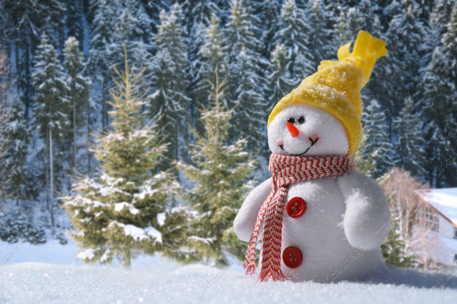 Image of Cute small decorative snowman outdoors on sunny day, space for text