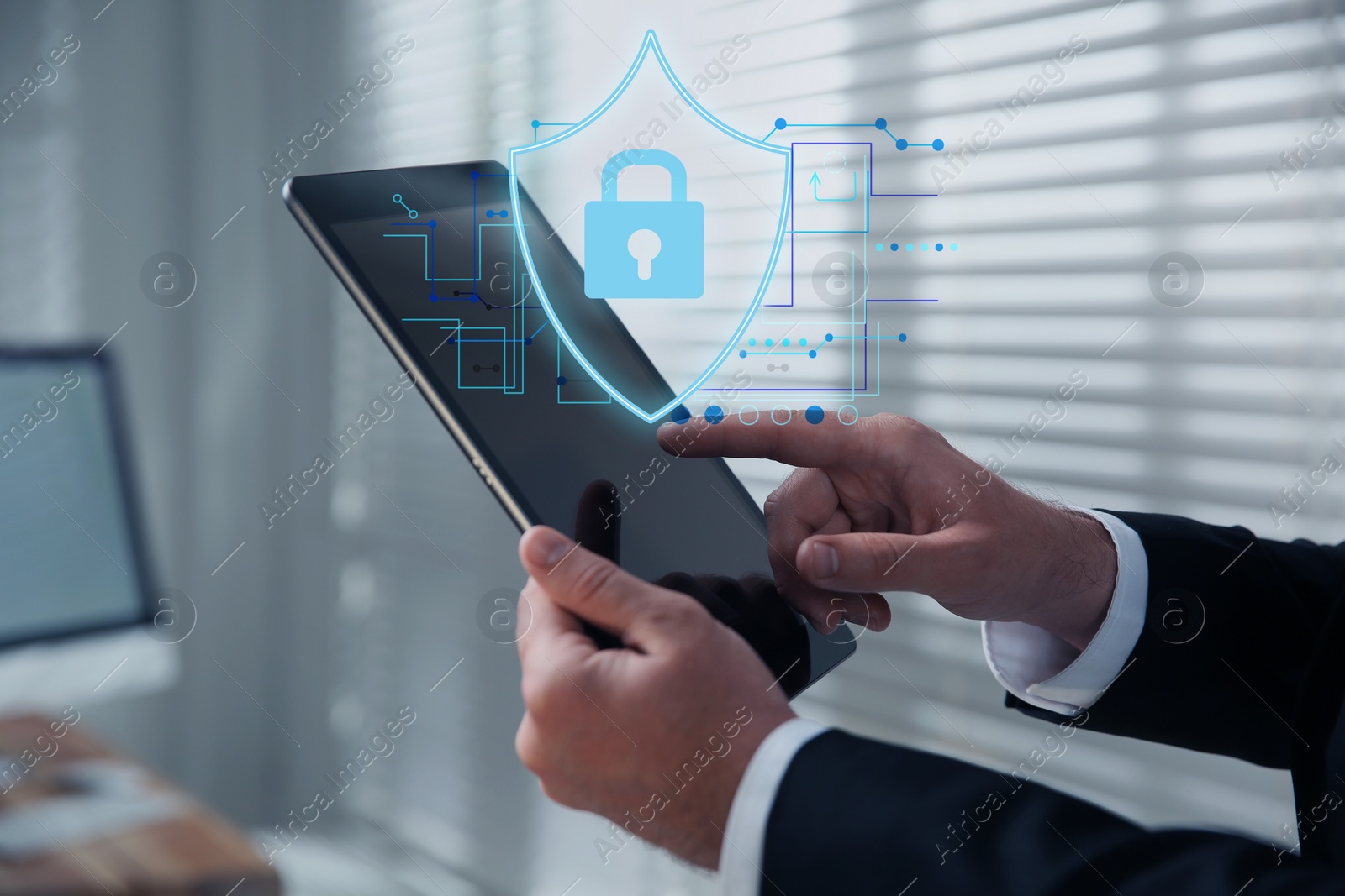 Image of Privacy protection. Man using tablet in office, closeup. Digital scheme with illustration of shield with padlock over device