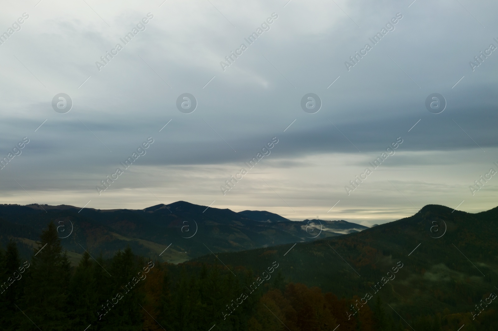 Image of Aerial view of beautiful mountain landscape on cloudy day