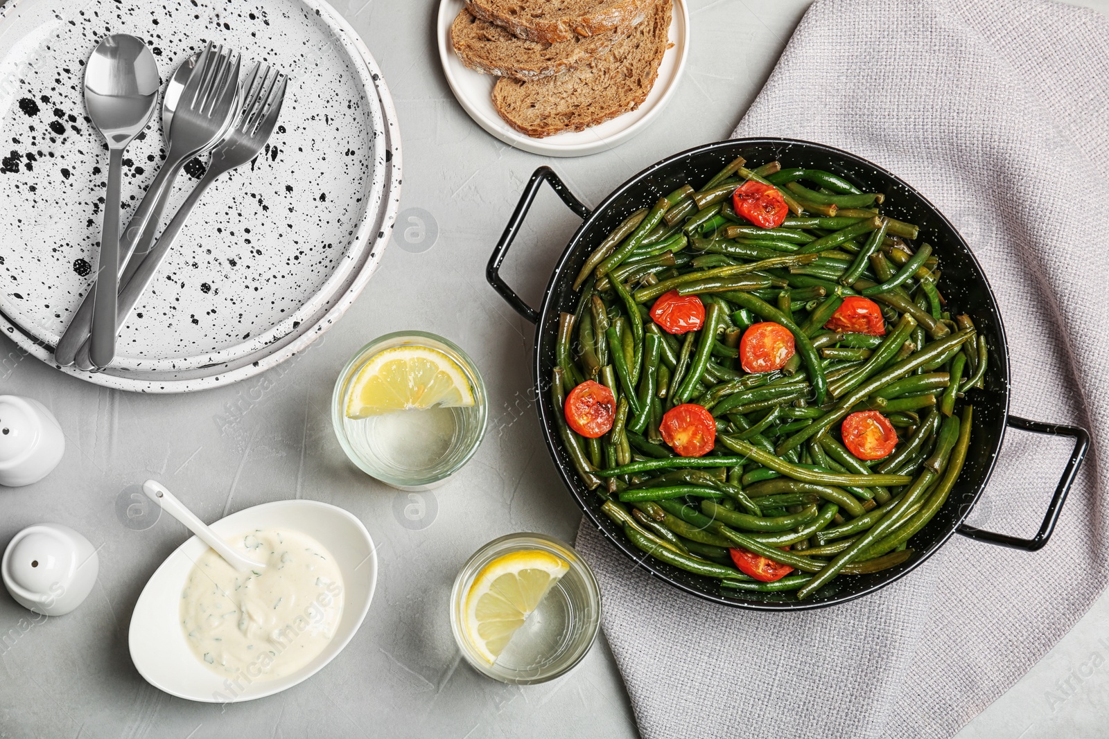 Photo of Tasty green bean dish served for dinner on table