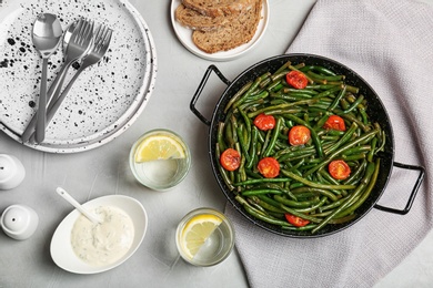 Photo of Tasty green bean dish served for dinner on table