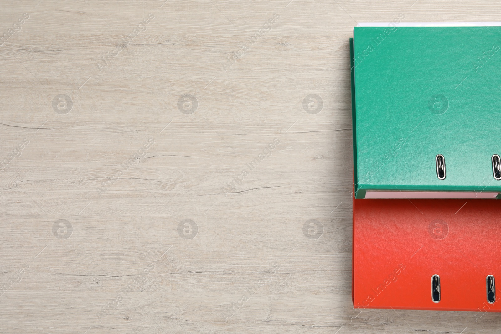 Photo of Office folders on white wooden table, flat lay. Space for text