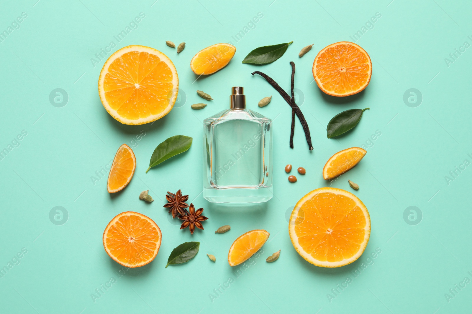 Photo of Flat lay composition with bottle of perfume and fresh citrus fruits on turquoise background
