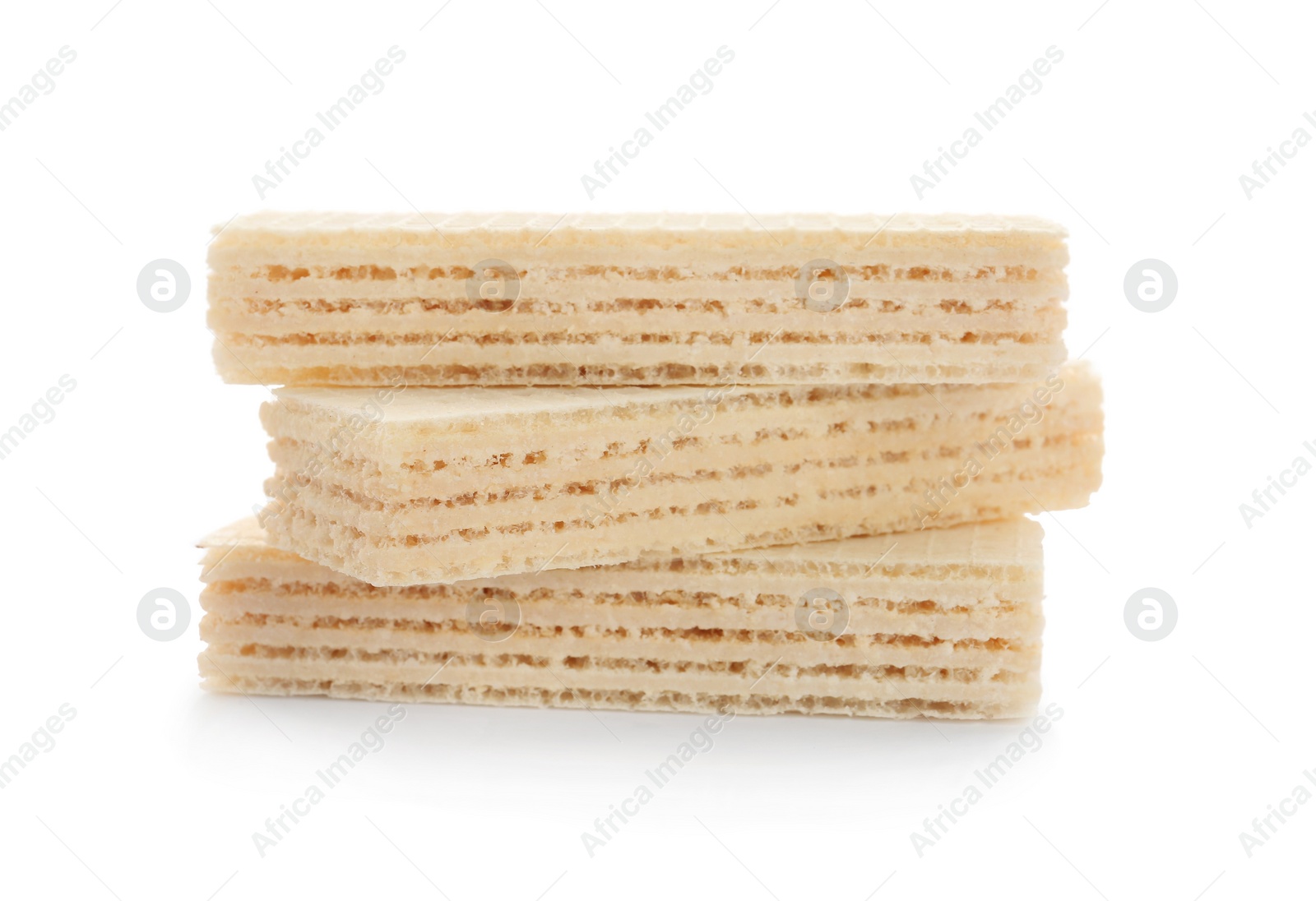 Photo of Delicious crispy wafers on white background. Sweet food