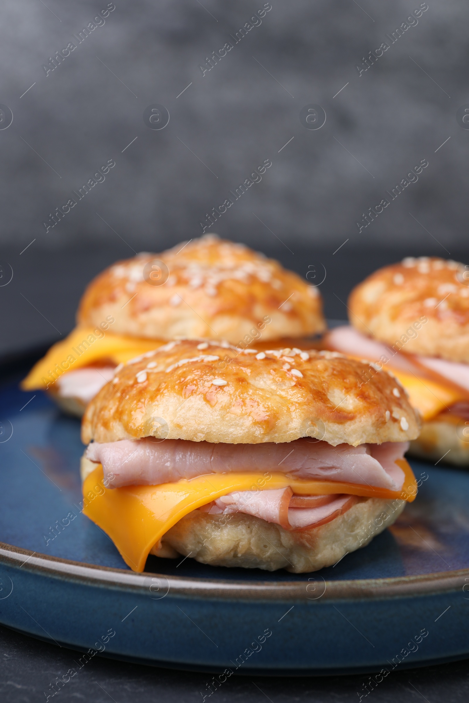 Delicious bagels with ham and cheese on table, closeup Photo of Delicious bagels with ham and cheese on table, closeup