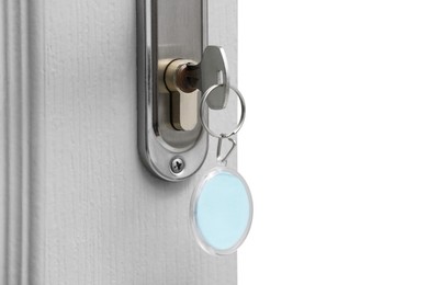 Photo of Key with fob in door lock, closeup. Space for text