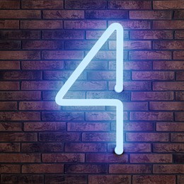 Image of Glowing neon number 4 sign on brick wall