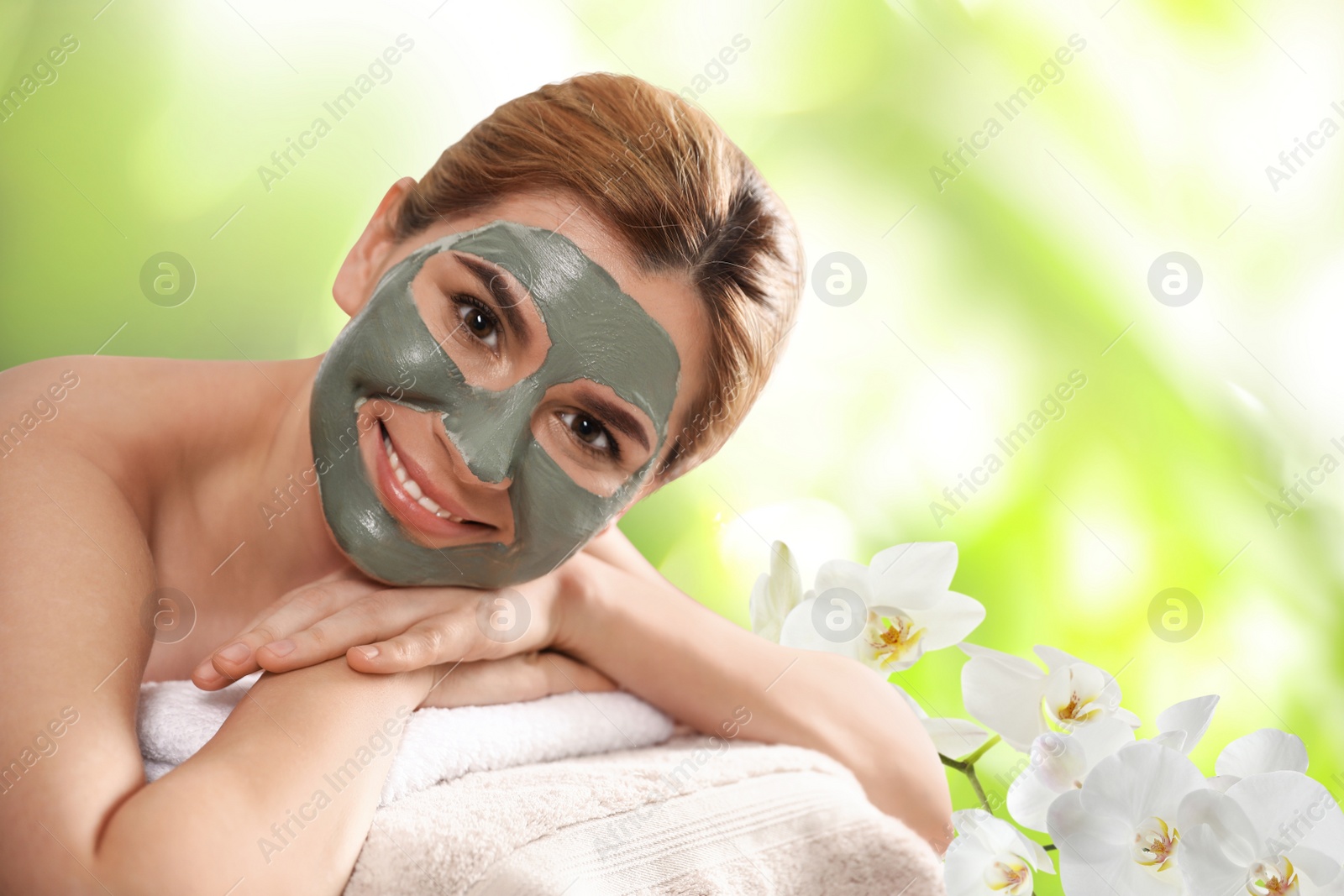 Image of Beautiful woman with mask on face, space for text. Spa treatment
