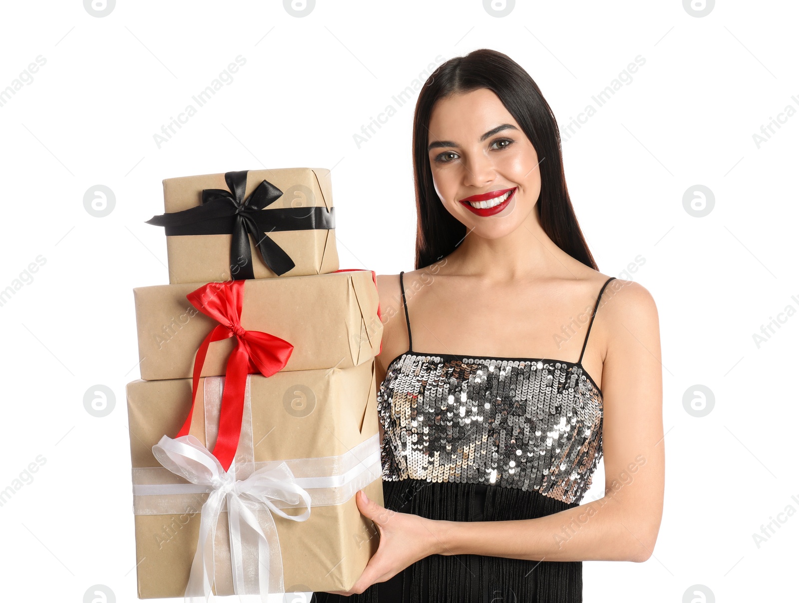 Photo of Woman in party dress holding Christmas gifts on white background