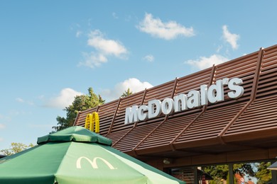 WARSAW, POLAND - SEPTEMBER 16, 2022: Signboard with McDonald's Restaurant logo outdoors