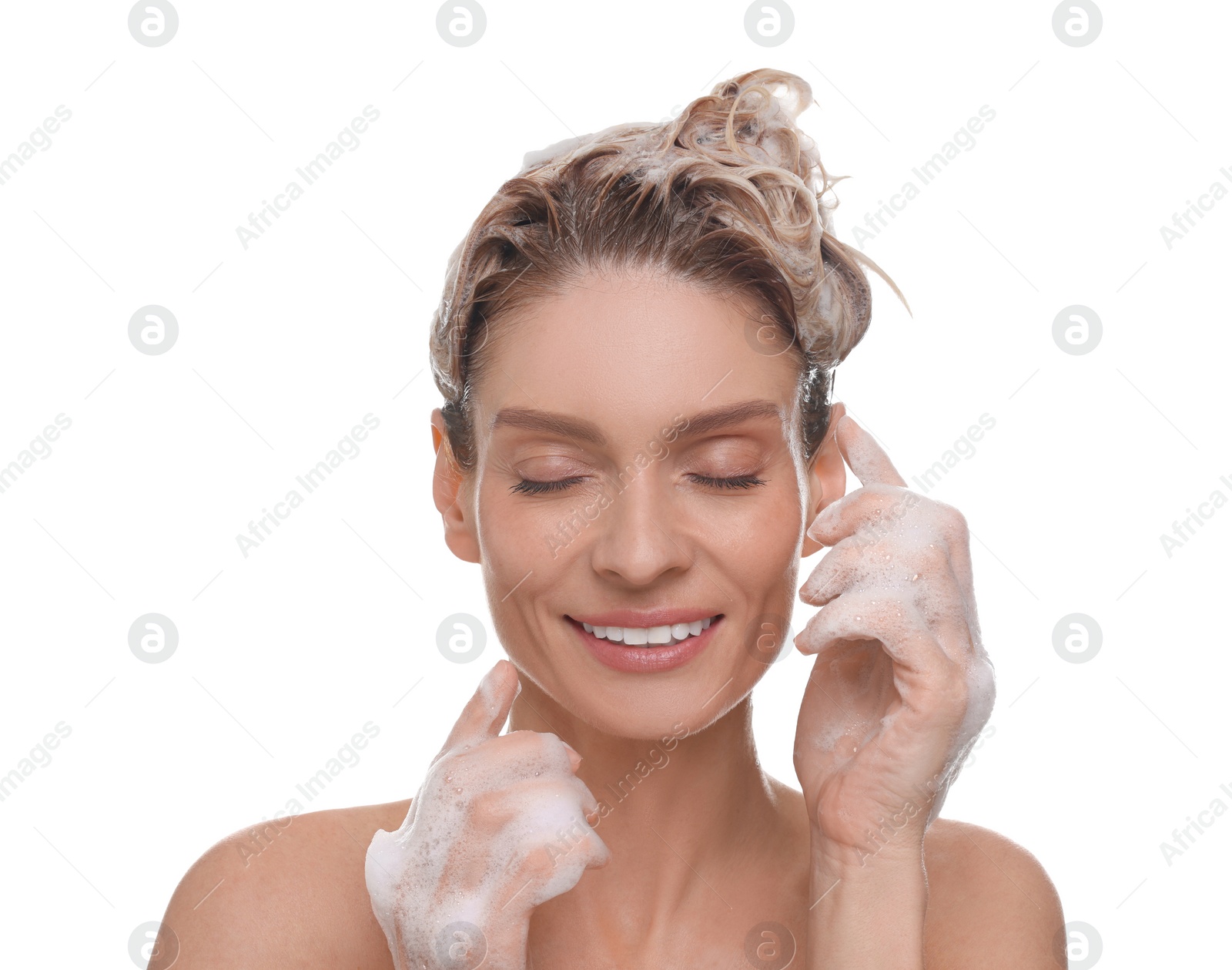 Photo of Beautiful happy woman washing hair on white background